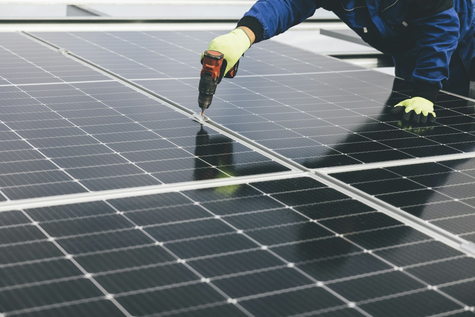 Technician working on a solar panel array